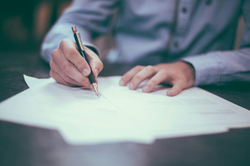Employee reviewing long-term disability paperwork at desk