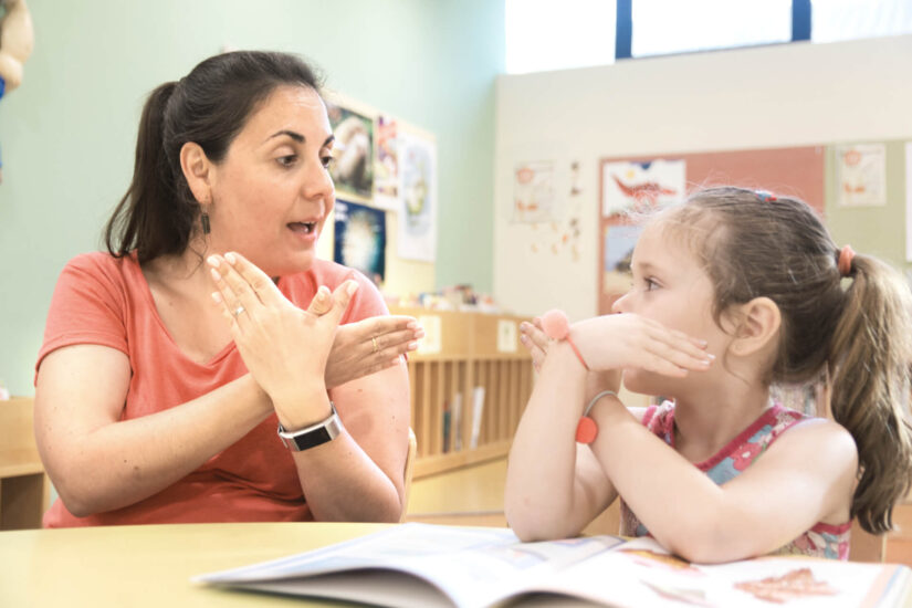 Teacher working one on one with a child with special needs